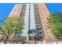 High-rise with brick facade, concrete accents, and balconies at 955 Eudora Street St # 108E, Denver, CO 80220