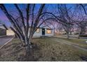 Ranch home features a classic design and inviting entryway at 401 S Oak St, Lakewood, CO 80226