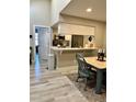 Dining area with modern table and chairs adjacent to the kitchen, creating a seamless flow at 7810 W 87Th Dr # E, Arvada, CO 80005