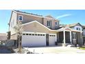 Charming two-story home features a three-car garage, well-manicured lawn, and inviting curb appeal at 7195 S Yantley Way, Aurora, CO 80016