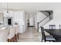 Bright open-concept with modern finishes, seamless flow, and a staircase at 7195 S Yantley Way, Aurora, CO 80016