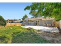 Spacious backyard with a patio, perfect for outdoor gatherings and featuring a basketball hoop at 2615 S Laredo Ct, Aurora, CO 80013