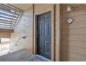 Condo entrance featuring a dark-colored door with number 924 and modern light fixture at 1632 W Canal Cir # 924, Littleton, CO 80120