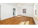 Bright, empty bedroom with hardwood floors and fan at 2570 Jay St, Edgewater, CO 80214