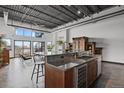 Open floor plan of kitchen and living area showcasing modern design and a sleek island at 2715 Blake St # 304, Denver, CO 80205