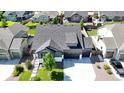 Beautiful neighborhood aerial view of homes with manicured lawns and green space at 15920 Buffalo Run Dr, Commerce City, CO 80022