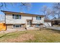 Charming split-level home with brick and vinyl siding and manicured front yard at 4429 S Field Ct, Littleton, CO 80123