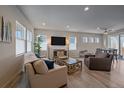 Bright living room with hardwood floors, large windows, and comfy seating at 10092 Flower St, Broomfield, CO 80021