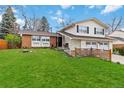 Charming two-story home with a well-manicured lawn, attached two-car garage, and inviting curb appeal at 1768 E Jamison Ave, Centennial, CO 80122