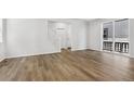 Bright and spacious living room with hardwood floors and sliding glass doors at 8787 Whiteclover St, Littleton, CO 80125