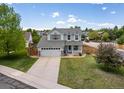 Beautiful two-story home featuring a spacious front yard and a cozy front porch for relaxing evenings at 2006 E 97Th Ave, Thornton, CO 80229