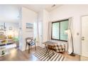 Bright living area featuring wood floors, a cozy seating area, and natural light from windows at 919 S Dawson Way # 17, Aurora, CO 80012