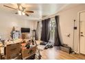 Inviting living room with hardwood floors, a ceiling fan, and natural light at 11816 Spring Dr, Northglenn, CO 80233
