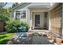 Charming front porch with seating area, creating a welcoming entrance to the home at 22379 E Dorado Ave, Aurora, CO 80015