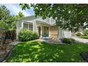 Inviting front yard with lush lawn and cozy seating area, perfect for enjoying the outdoors at 22379 E Dorado Ave, Aurora, CO 80015