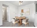Dining area with contemporary round table and stylish chairs at 1980 S Xanadu Way # 208, Aurora, CO 80014