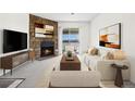 Cozy living room featuring a stone fireplace and sliding glass doors at 1980 S Xanadu Way # 208, Aurora, CO 80014