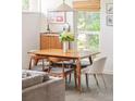 Cozy dining area featuring a wooden table, stylish chairs, and lots of natural light at 2849 E Cresthill Ave, Centennial, CO 80121