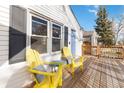 Relaxing deck with yellow Adirondack chairs, perfect for outdoor enjoyment at 3825 W 73Rd Ave, Westminster, CO 80030