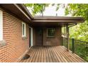 Inviting back deck perfect for outdoor entertaining, with a brick exterior and ample space at 654 S Shoshone St, Denver, CO 80223