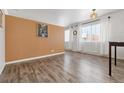 Spacious living room featuring hardwood floors and large windows at 855 N Pennsylvania St # 407, Denver, CO 80203