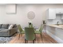 Open living room with kitchen, dining area, and comfortable gray couch at 328 E Dakota Ave, Denver, CO 80209