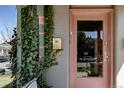 Close up of the front door with ivy, mail box, and brick columns at 2358 N Ogden St # B, Denver, CO 80205