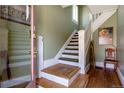 Entryway featuring a staircase with detailed banisters and hardwood flooring at 2358 N Ogden St # B, Denver, CO 80205