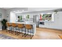 Spacious kitchen island with granite countertops, stainless steel appliances, and bar stool seating at 14428 W Ellsworth Pl, Golden, CO 80401