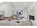 Bright living room with high ceilings, fireplace, and sliding doors to the outdoors at 6358 S Jackson St, Centennial, CO 80121