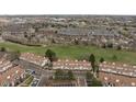 An aerial view of townhomes in a community with green spaces and a golf course nearby at 3026 W Prentice Ave # H, Littleton, CO 80123