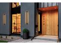 Close-up view of the modern front entrance with sleek lighting and wooden door at 2378 S Bannock St, Denver, CO 80223
