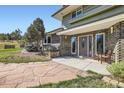 Inviting front entrance featuring a brick facade, a large front door, and stone walkway at 6227 Colorow Dr, Morrison, CO 80465
