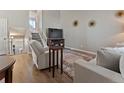 Cozy living room with a TV, a comfortable recliner and modern decor, creating a relaxing atmosphere at 17411 E Layton Dr, Aurora, CO 80015