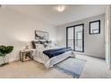Bright bedroom with a cozy bed and a private balcony entrance at 1937 S Columbine St, Denver, CO 80210