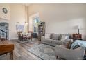 Open concept dining area with a six-person table and large windows at 20572 E Girard Dr, Aurora, CO 80013