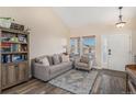 Bright living room featuring hardwood floors and comfortable seating at 20572 E Girard Dr, Aurora, CO 80013