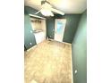 Convenient laundry area with washer, dryer, tile flooring and access to the backyard at 55619 E 31St Ave, Strasburg, CO 80136