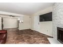 Open-concept living room featuring stylish tile flooring and lots of natural light at 12047 E Harvard Ave # 103, Aurora, CO 80014