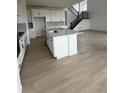 Modern kitchen with a large island, stainless steel appliances, and an open layout at 8836 Whiteclover St, Littleton, CO 80125