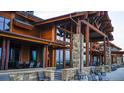 Community clubhouse with a large covered patio and stone accents at 2962 Newfound Lake Rd, Berthoud, CO 80513