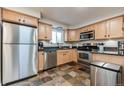Modern kitchen with stainless steel appliances and granite countertops at 601 Cheyenne St # 202, Golden, CO 80403