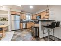 Modern kitchen with stainless steel appliances and granite countertops at 601 Cheyenne St # 202, Golden, CO 80403