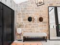 Charming entryway featuring a stone wall, rustic accents, and stylish western decor at 18910 Augusta Dr, Monument, CO 80132
