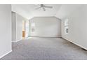 Spacious main bedroom featuring a vaulted ceiling and plush carpet at 9471 Crossland Way, Highlands Ranch, CO 80130