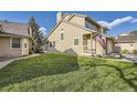 A well-maintained home with a lush green lawn, showcasing its charming curb appeal and exterior features at 8208 S High Ct, Centennial, CO 80122