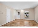 Living room with hardwood floors and neutral walls at 1740 Shallot Cir, Lafayette, CO 80026