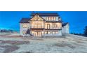 Expansive backyard featuring a balcony and stairs, perfect for outdoor entertaining and enjoying the view at 912 Coronado Dr, Sedalia, CO 80135