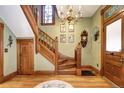Ornate wooden staircase with detailed banister in a classic home at 1563 High St, Denver, CO 80218