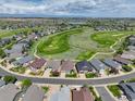 Panoramic aerial view of the neighborhood, showcasing the golf course and nearby homes at 14879 Xenia St, Thornton, CO 80602